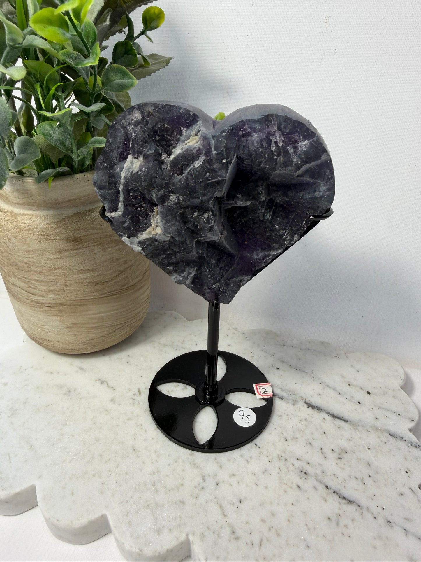 Raw fluorite heart on stand